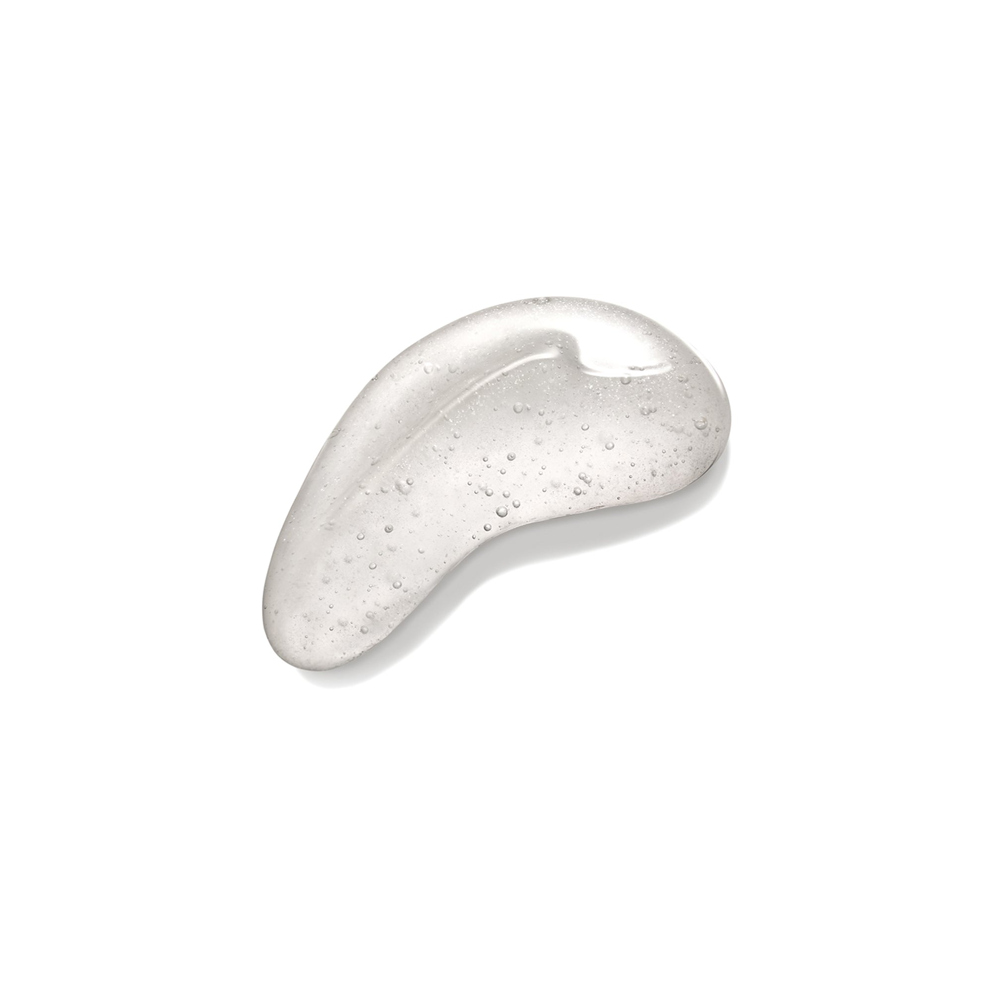 A clear, gel-like droplet of 19/99 High Shine Gloss with tiny air bubbles, shaped like a curved teardrop, rests on a white background.