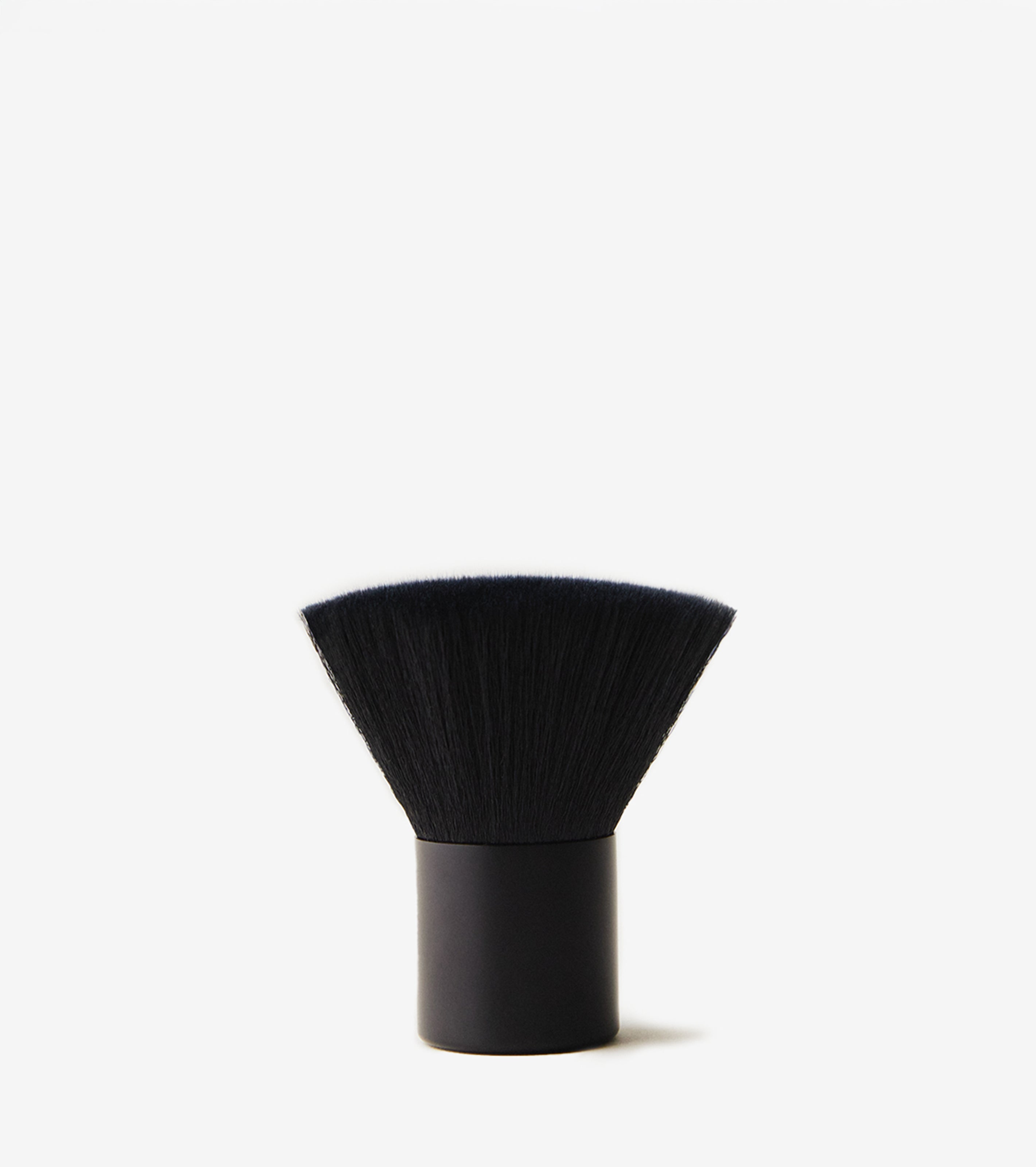 Brush No. 1 is a black face blending brush with a wide, dense bristle head and a short cylindrical handle, shown upright on a white background—ideal for stain-free makeup or Tanning Water application.