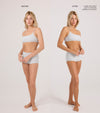 Side-by-side photos of a woman in gray underwear, labeled Before and After. In the After, she has a natural-looking full body tan from Tanning Foam, shade light to medium. No makeup needed due to its easy water-to-foam body care formula.