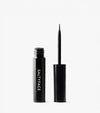 A black tube labeled Freckle Paint stands upright next to its cap, exposing a thin, pointed brush applicator against a white background—ideal for defining natural freckles or creating a sun-kissed look.