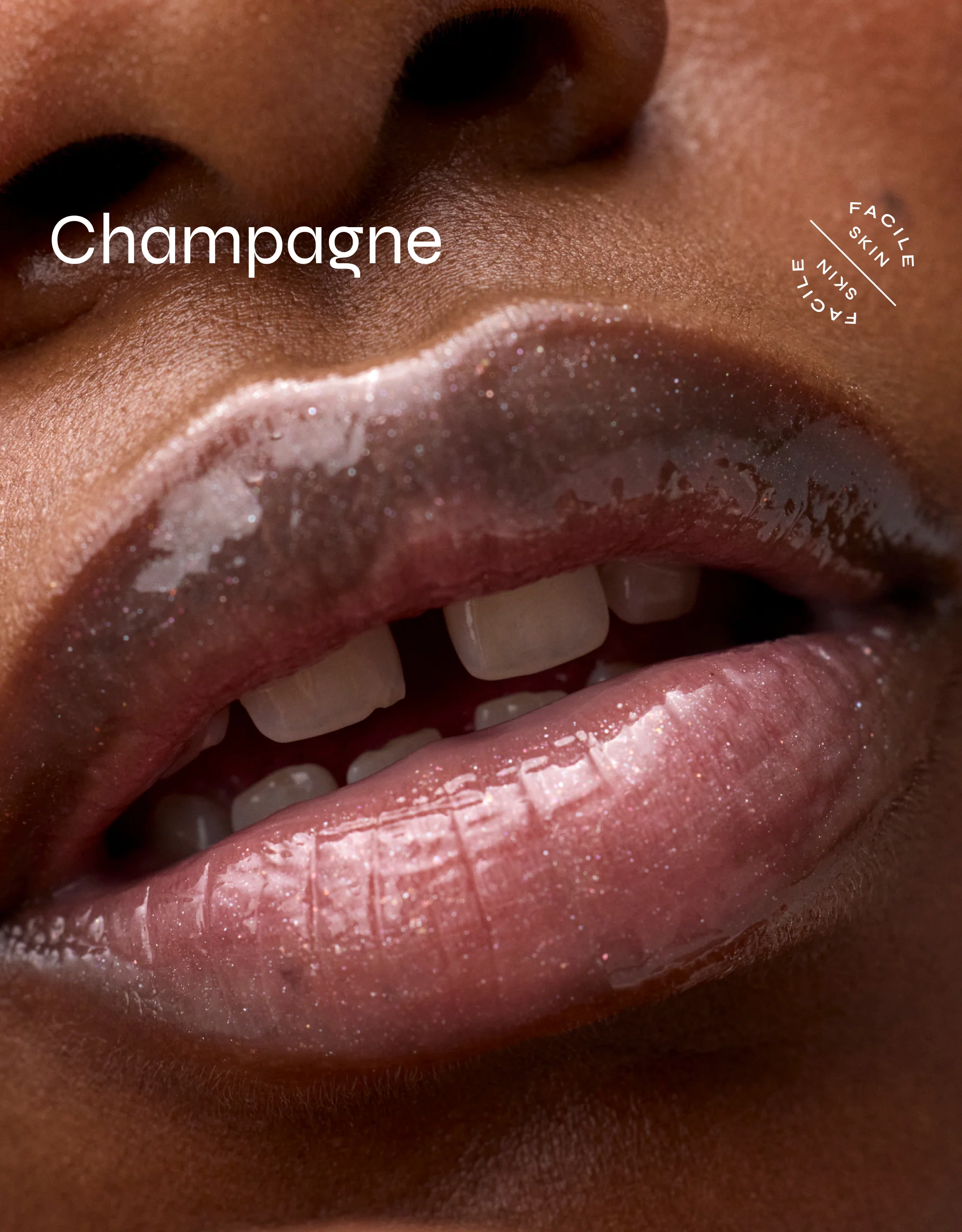 A close-up of glossy, shimmering lips slightly parted to reveal white teeth. “Facile – Champagne Lip Jelly Tint” appears on the left, with the Facile Skin circular logo on the right.