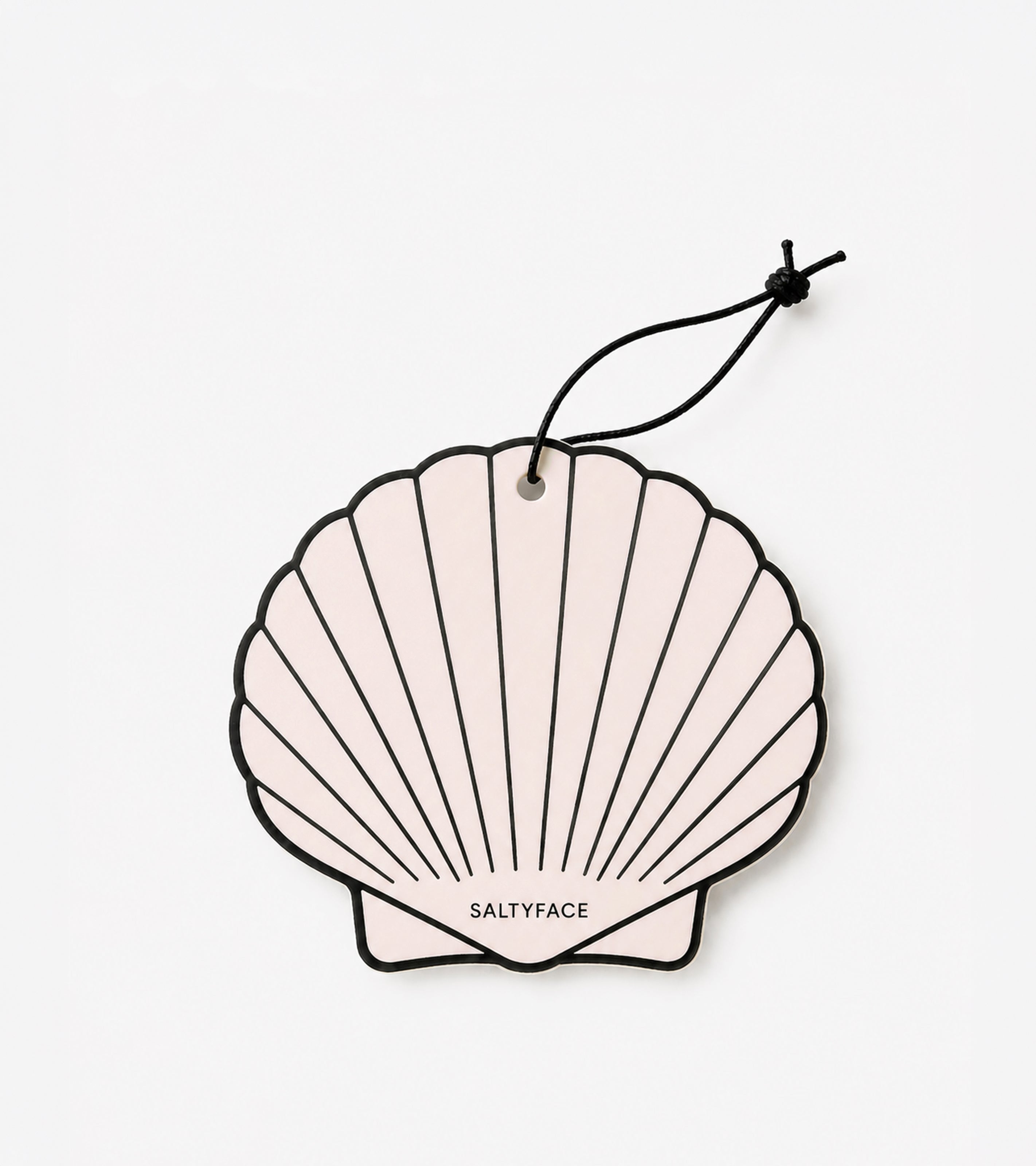 A pale pink, shell-shaped Air Freshener with a black outline and string. "SALTYFACE" is printed near the bottom center, making it perfect for gifts or coastal-themed décor.