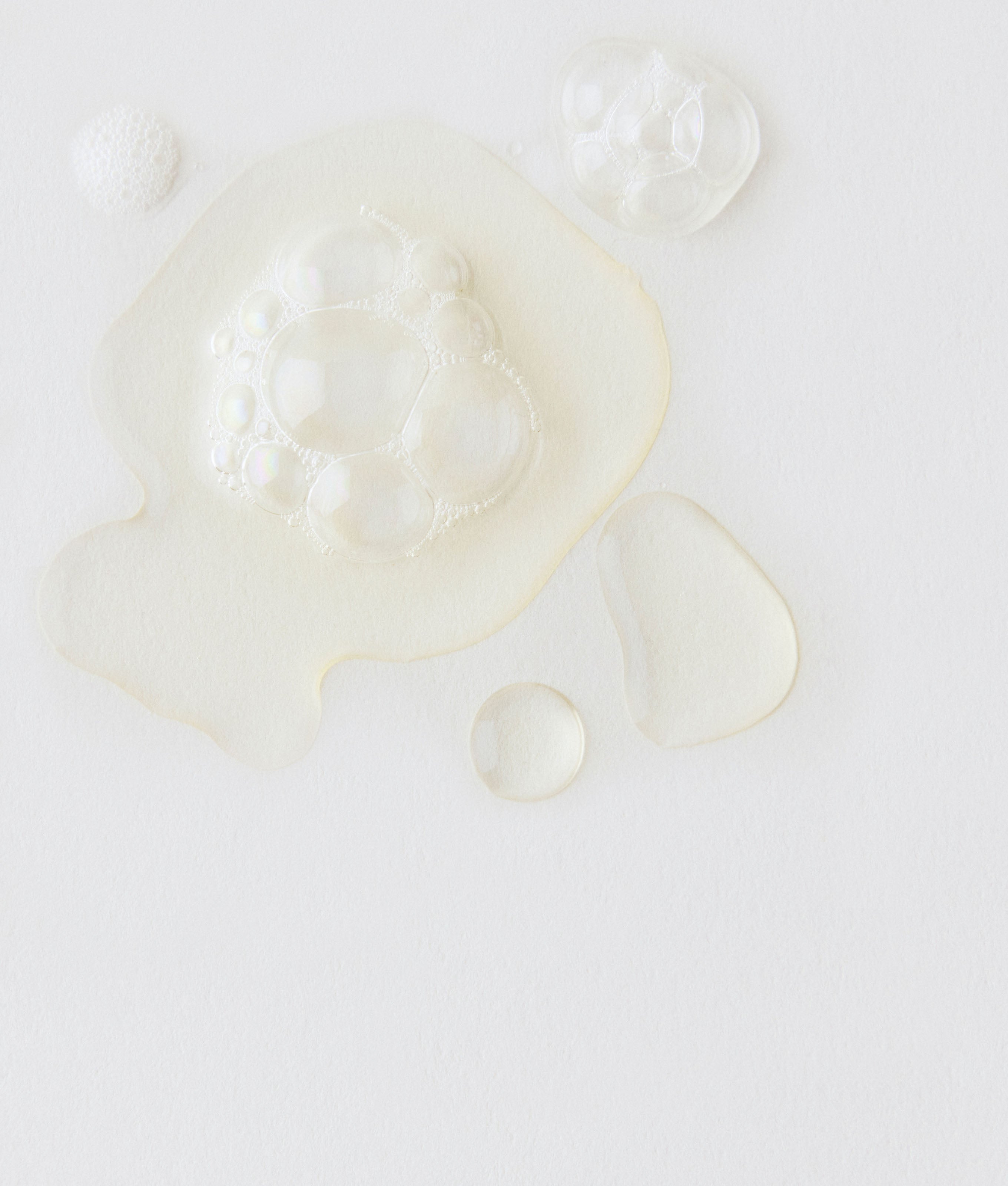 Clear, watery product is shown against a white background. 