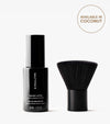 A black bottle labeled The Face Set stands next to a short, wide face brush with black bristles. A circle on the right reads, Available in Coconut. Perfect for achieving a flawless face tan on a white background.